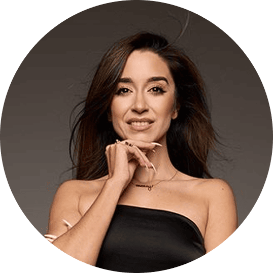 Professional portrait of speaker Moncy Trejo posing against a dark background, looking poised and confident.